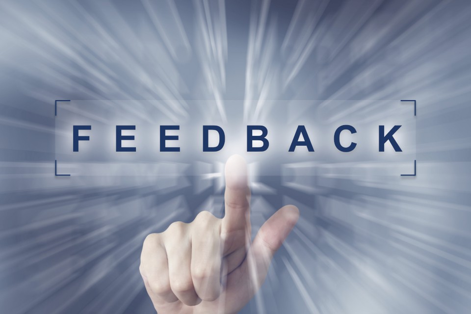 hand clicking on feedback button